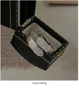Close-up of S925 sterling silver crisscross ring with textured finish and square zircon