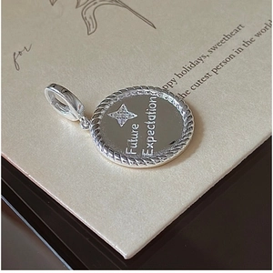 Close-up of S925 sterling silver star pendant with Future Expectation engraving