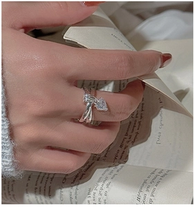Detailed close-up of S925 silver double-layered ring with a hanging heart zircon pendant