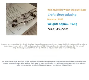 Detail of S925 silver water drop pendant on woven necklace with tiger eye beads