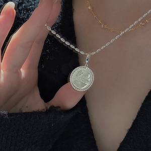 S925 silver coin necklace with star relief and Future Expectation engraving detail