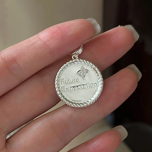 Vintage S925 silver star pendant with Future Expectation engraving on a round disc