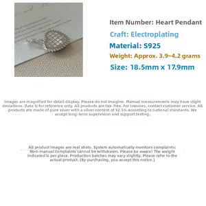 Macro shot of S925 sterling silver heart pendant with textured grid pattern and measurements