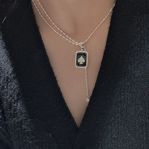 S925 sterling silver necklace featuring black spade pendant and a small drop diamond
