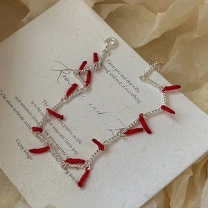 S925 sterling silver red cord bracelet with twisted rope chain in a retro festive style