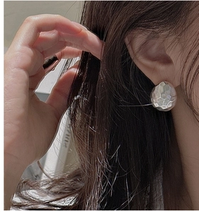 Detailed view of handmade hammered texture on S925 sterling silver round stud earrings