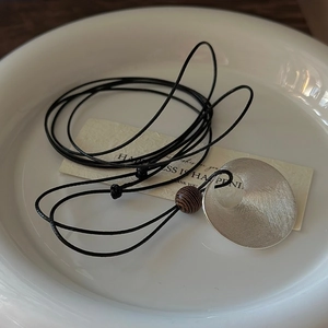 Minimalist S925 silver long necklace featuring a brushed metal pendant and wooden bead
