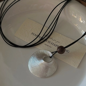 Minimalist S925 silver sweater necklace with brushed texture and dark wooden bead