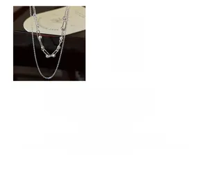 Macro shot of 925 sterling silver double-layered chain necklace with rectangle links