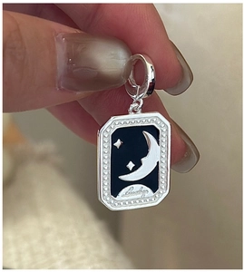 Close-up of S925 silver retro star and moon tarot pendant with Lucky engraving