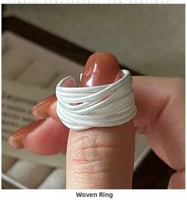 Macro detail of multilayer silver wire wrap ring with elegant matte finish and open band