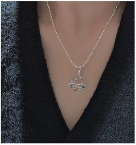 Detail of S925 sterling silver Lucky pendant with star engraving on chain
