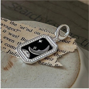 Detail of S925 silver rectangle charm with black enamel moon, star and Lucky engraving