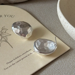 S925 sterling silver earrings with irregular lava texture on minimalist stud design