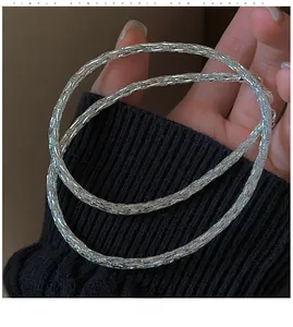 Detailed view of the woven silver texture and 3D structure of the S925 sterling necklace
