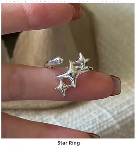 Close-up of S925 sterling silver star ring with minimalist open design on hand