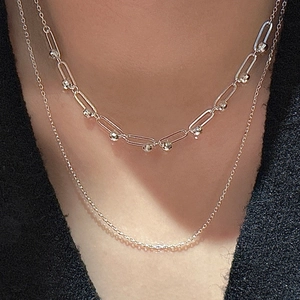 925 silver double-layered necklace with paperclip chain and bead details on a model