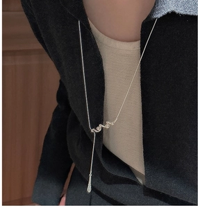 Detailed view of S925 silver Y-shaped necklace with Love script lettering on model