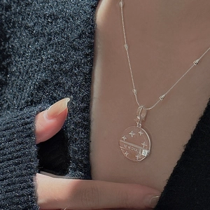 Elegant S925 sterling silver star necklace with lucky engraved round pendant on neck