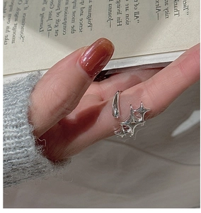 Macro detail of S925 sterling silver star ring with interlocking minimalist aesthetic