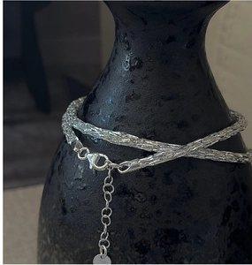 Close-up of S925 sterling silver chain with lobster clasp and ITALY hallmark tag
