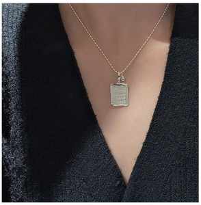 Detail of S925 sterling silver rectangular pendant with You deserve to be loved engraving
