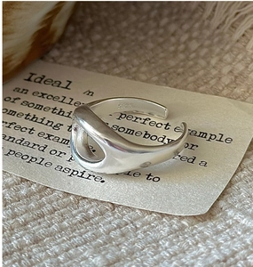 Macro shot of S925 sterling silver stamp on minimalist hollow oval adjustable ring