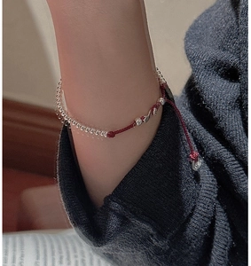 Detailed view of handmade S925 silver beaded bracelet with adjustable red braided rope