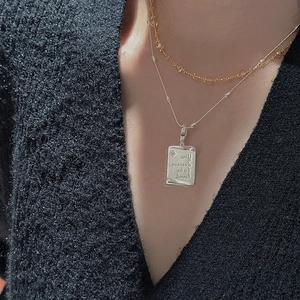 Layered S925 silver necklace featuring a rectangular pendant with inspirational engraving