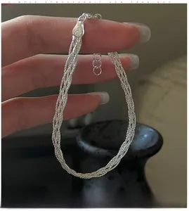 Macro shot of S925 sterling silver braided bracelet with Italy engraved clasp and extension chain