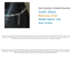 Detailed macro view of S925 sterling silver woven bracelet with lobster clasp and chain