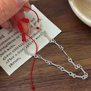 Handcrafted S925 sterling silver chain bracelet with adjustable red woven rope design
