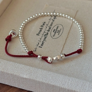 Minimalist S925 sterling silver beads red rope bracelet with hollow pendant on jewelry box