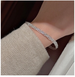 Macro shot of S925 sterling silver braided twist bracelet with Italy hallmark engraving