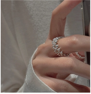 Close-up of S925 sterling silver beaded ring with gradient beads on a model hand