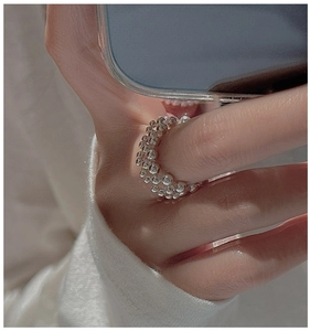 Minimalist S925 sterling silver beaded rings stacked on finger for a stylish daily look