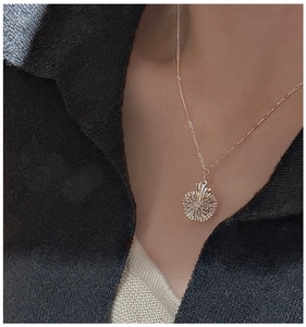 Detail of S925 sterling silver apple necklace with textured finish and mixed chain design
