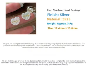 Detail of silver heart-shaped earring with 'change' engraving and size measurements
