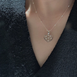 S925 sterling silver heart pendant necklace with star patterns on a bead chain