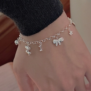 S925 sterling silver chain bracelet with puppy, bell, bone, and floral charms
