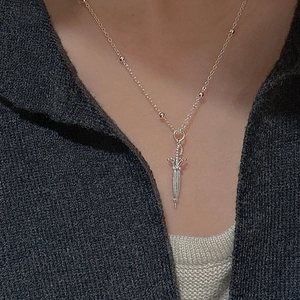 Minimalist S925 sterling silver umbrella necklace on elegant dark grey knitwear
