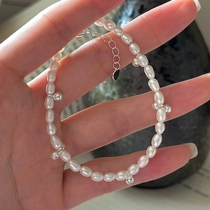 Handmade S925 sterling silver freshwater pearl bracelet with silver ball charms on wrist
