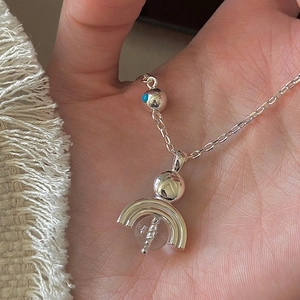 S925 sterling silver necklace with geometric crystal pendant held in hand for scale