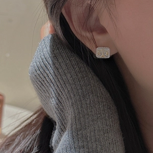 Minimalist S925 sterling silver square stud earrings with golden scale relief on model