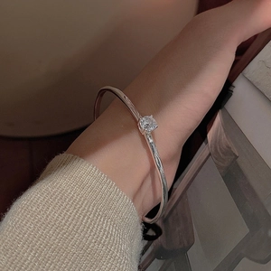 Elegant S925 sterling silver open bangle with sparkling cubic zirconia on female wrist
