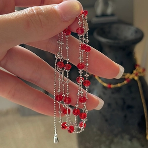 Handheld view of S925 sterling silver multilayer necklace with red faceted crystal beads