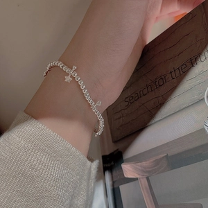S925 sterling silver beaded bracelet with star charm worn on woman wrist