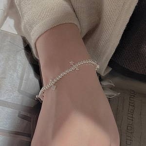 Minimalist S925 sterling silver beaded bracelet with star and clover charms on wrist
