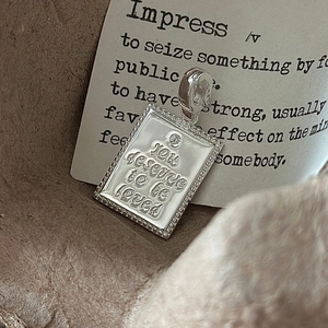 S925 sterling silver rectangular pendant with engraved text and a single zircon stone