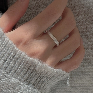 Textured S925 sterling silver ring featuring a brushed finish worn with a cozy sweater